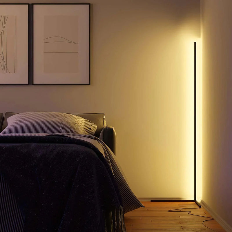 Lamp in a bedroom corner giving off a soft yellow glow, with a trailing cable 4