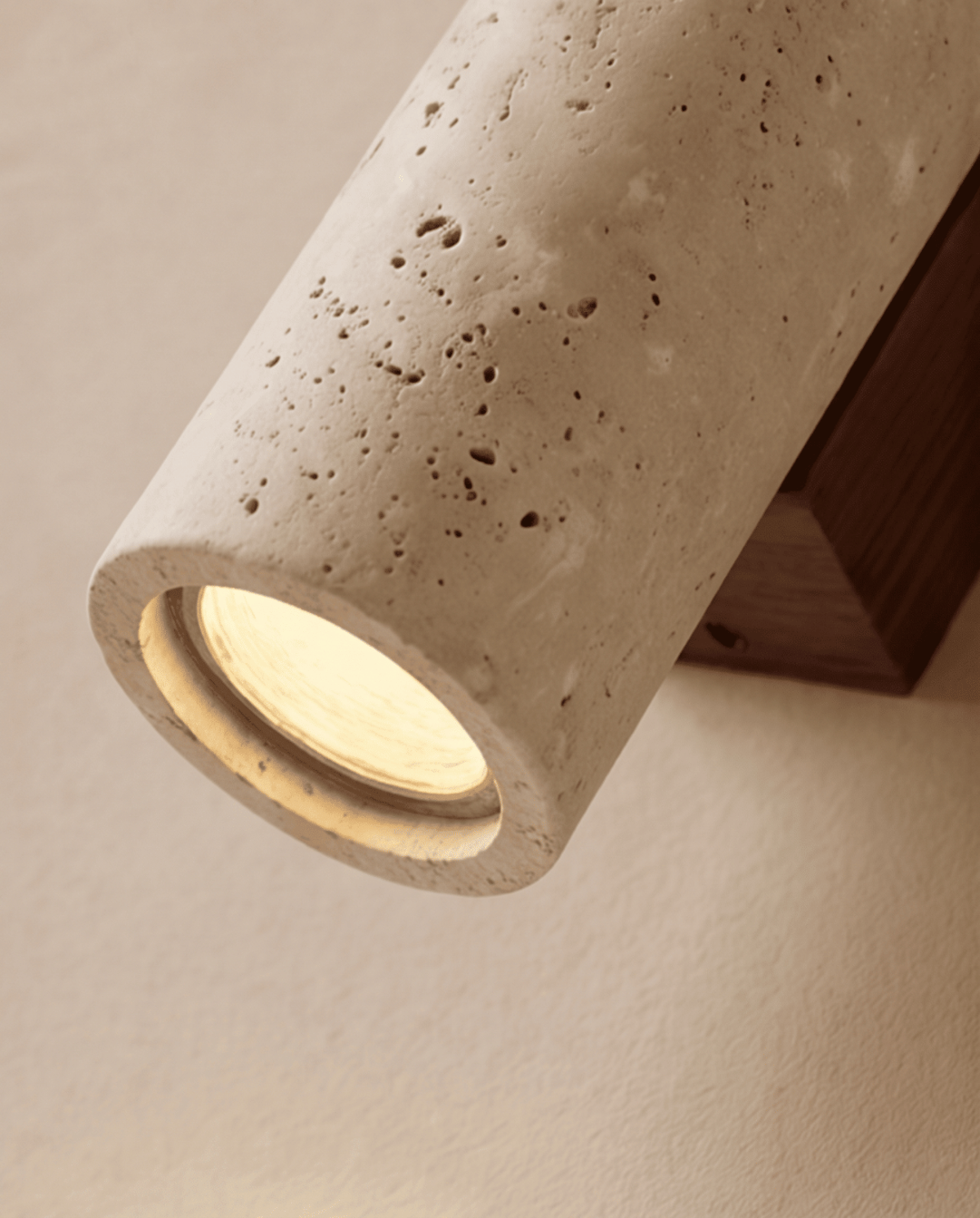 Close-up of the lower end showing the lit bulb opening, travertine pores and wooden bracket 5