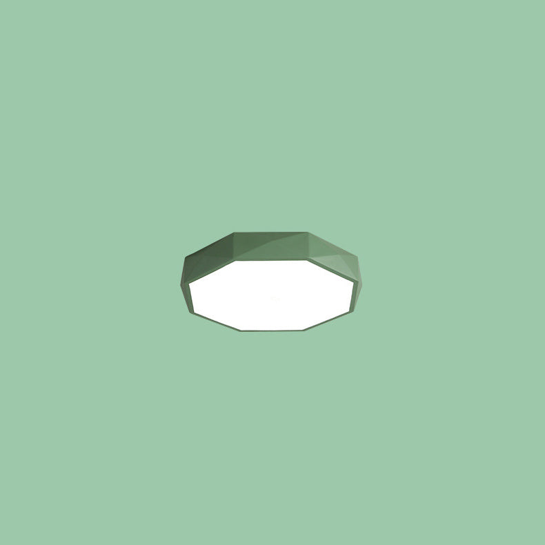 Green faceted octagonal flush-mount light floating against a plain green background 12