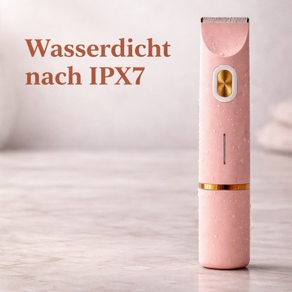 Pink trimmer covered in water droplets standing on a marble surface, illustrating its waterproof rating. 11