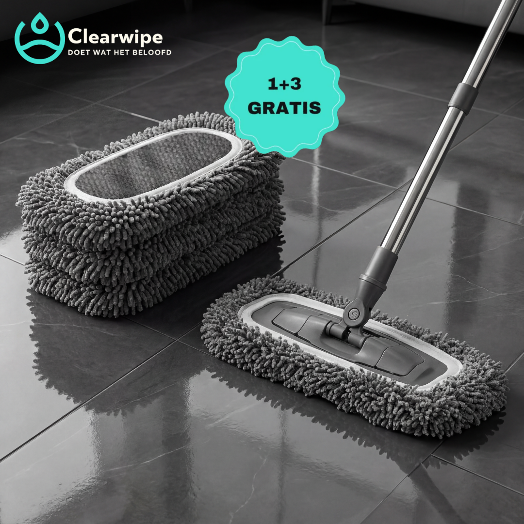 Stack of grey chenille mop pads beside a flat mop head with a metal handle on glossy dark floor tiles. 1