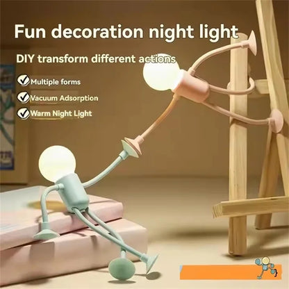 Pink and green figure lights posed against a wooden easel, with text listing features such as suction and warm light 5