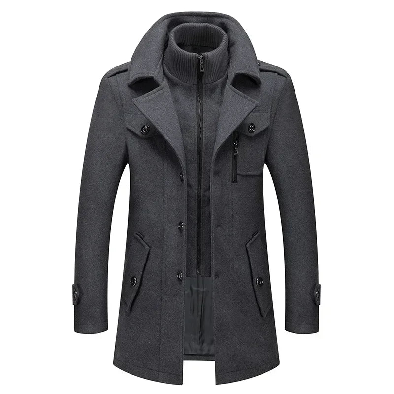 Grey coat from the front, showing the layered knitted collar, chest zip pocket and lower flap pockets 5