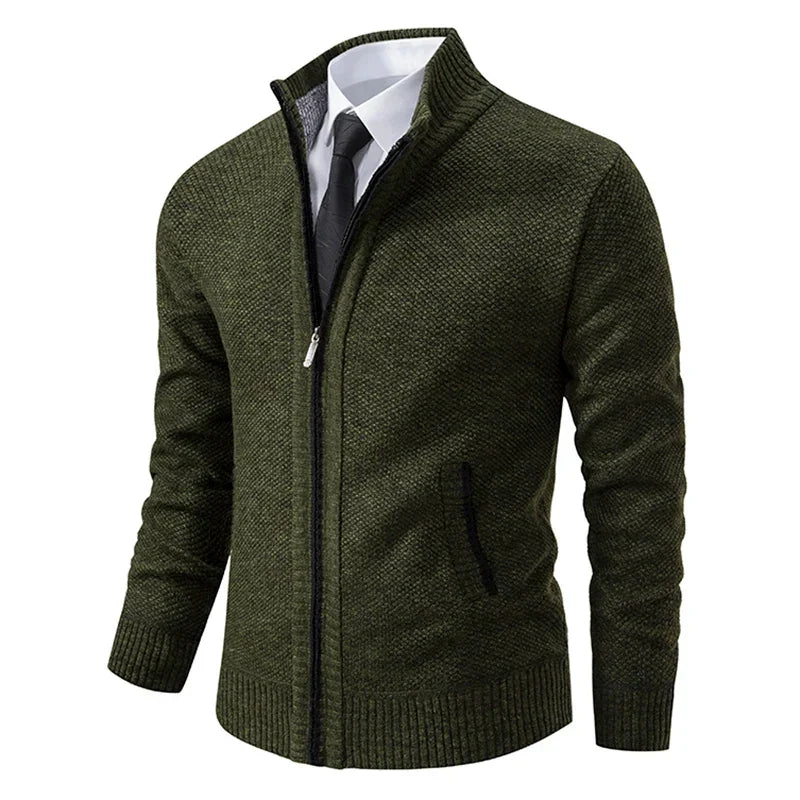 Dark olive green zip cardigan at an angle, worn over a white shirt and black tie 5