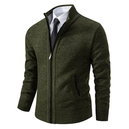 Dark olive green zip cardigan at an angle, worn over a white shirt and black tie 5