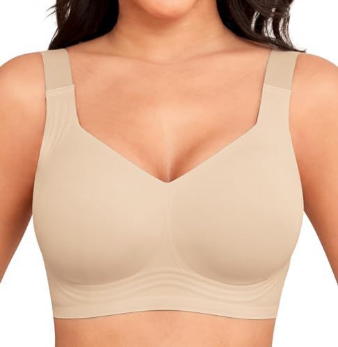 Front view of a beige seamless wireless bra with wide straps, worn by a model 1