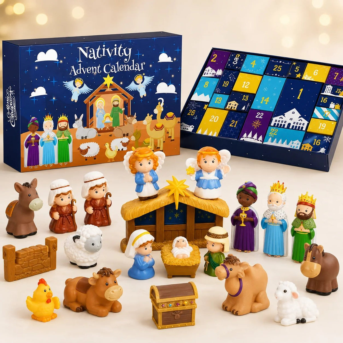 Boxed calendar beside its open numbered tray, with all the colourful figures, animals, stable, fence and treasure chest 2