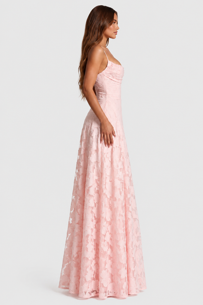 Side profile of a pale pink raised floral lace gown, showing the draped neckline, fitted waist and long skirt. 7
