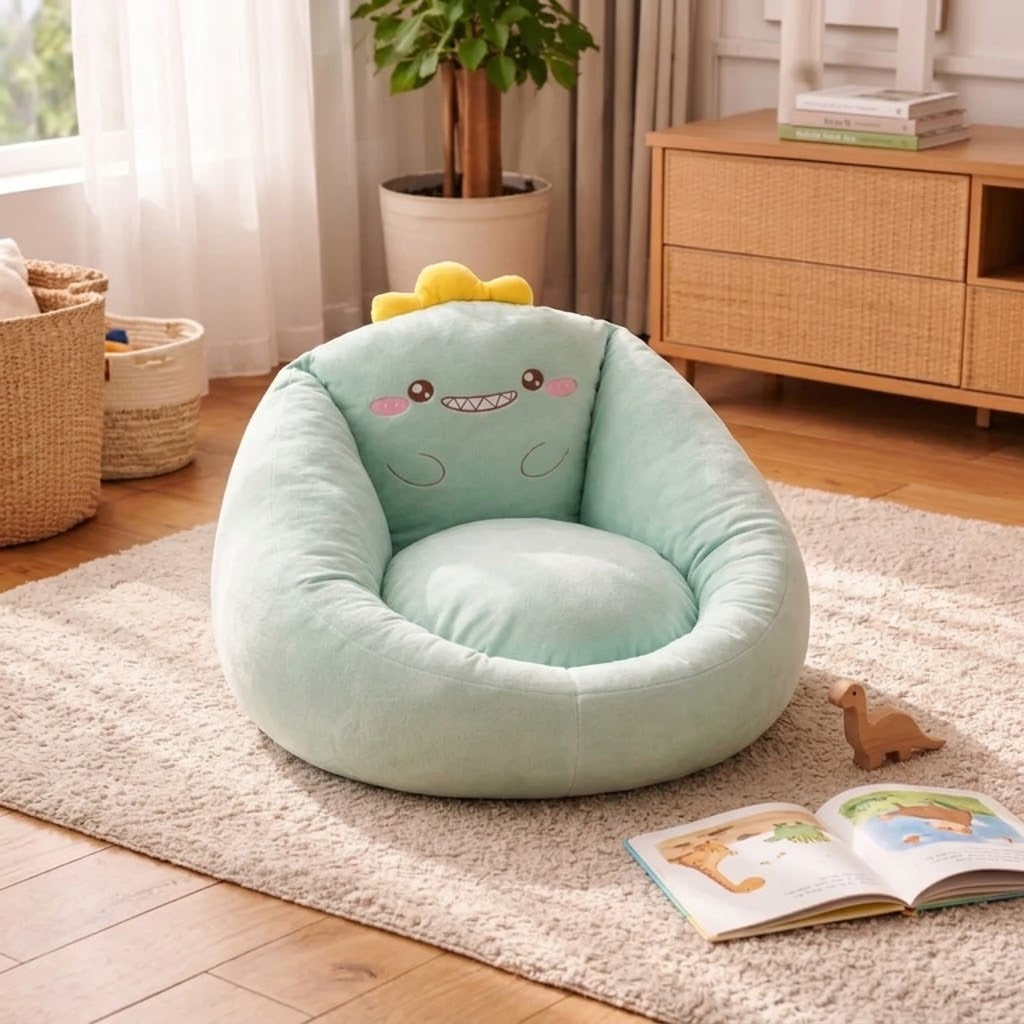 Mint green dinosaur-design bean bag chair with a yellow crest, beside a toy dinosaur and open book 6