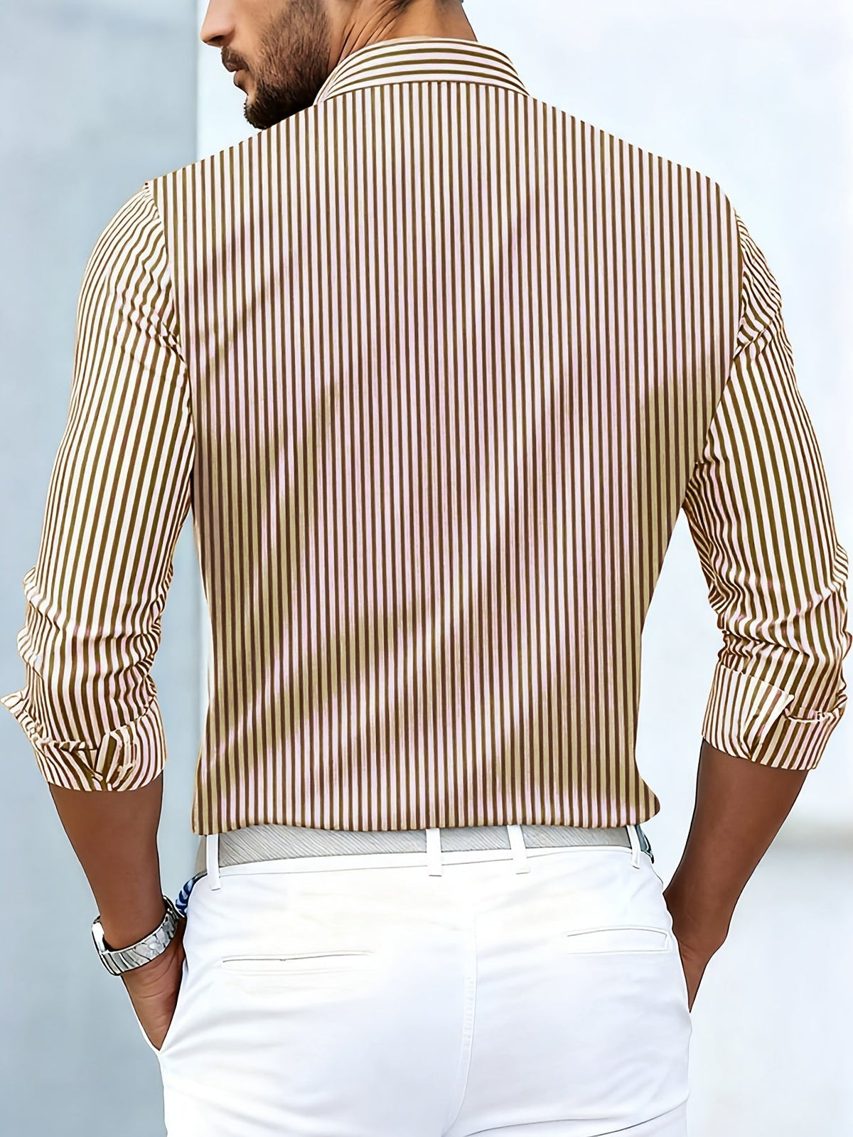 Back view on a model of the brown and cream striped shirt, showing plain vertical stripes and a collar. 6
