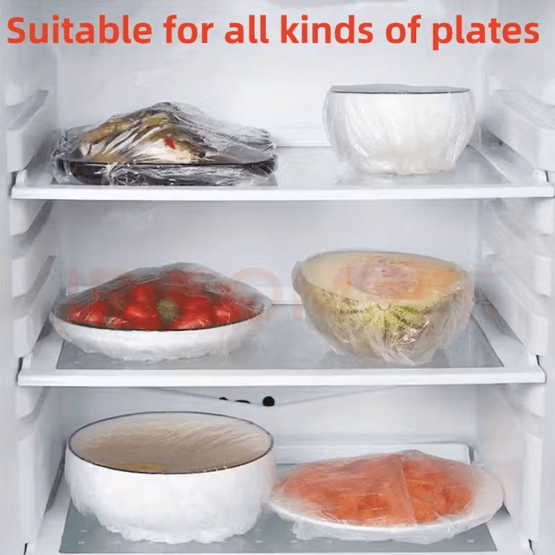 Fridge shelves holding bowls, plates and half a melon, each wrapped in a clear elastic cover. 7