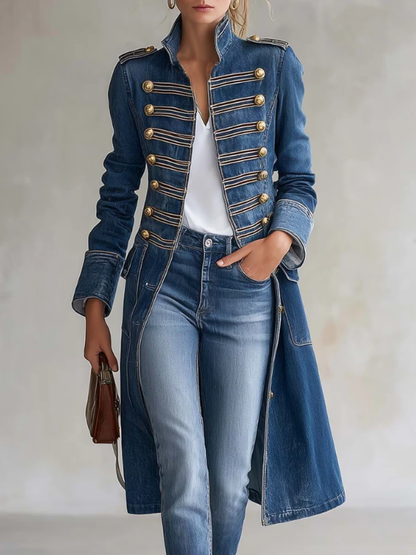 Model wearing the blue denim coat open over a white top and jeans, with gold buttons, braiding and a hand in the pocket. 1