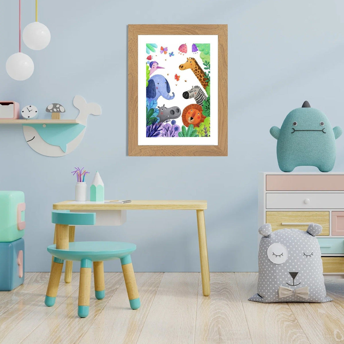 Oak-effect frame hanging on a blue nursery wall, holding a colourful illustration of jungle animals. 14