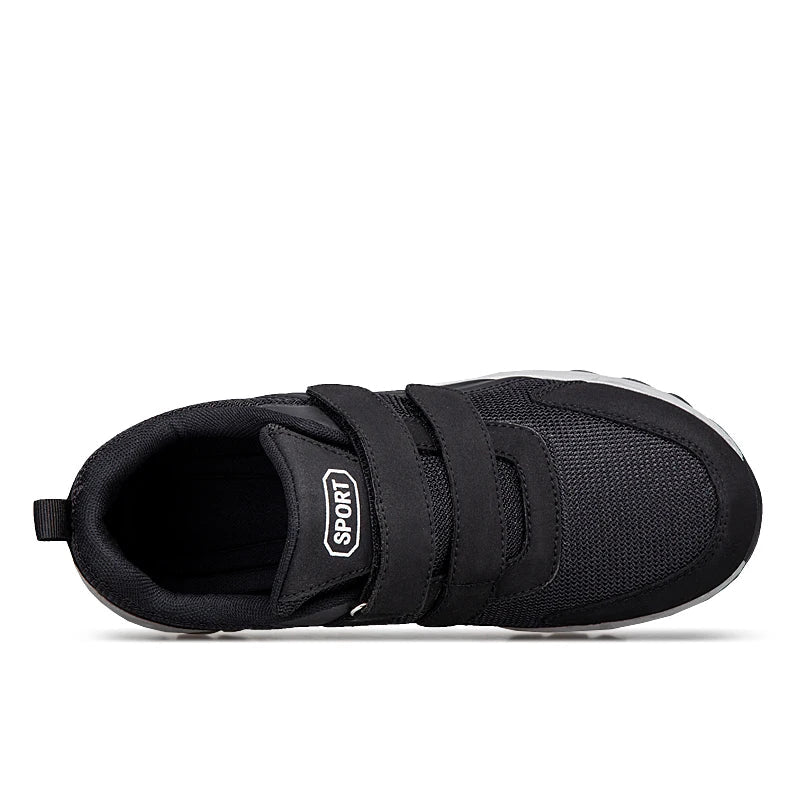 Black shoe seen from above, showing the straps, padded collar and inner opening 16