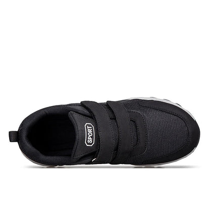 Black shoe seen from above, showing the straps, padded collar and inner opening 16