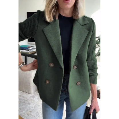 Dark green double-breasted jacket with ribbed sleeves, closer crop showing lapels and four buttons 6