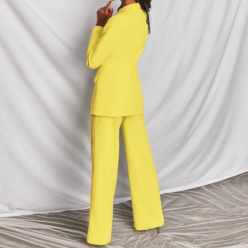 Bright yellow blazer and wide-leg trousers seen from the side and back, model in profile 6