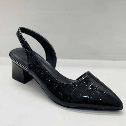 Black glossy croc-pattern slingback in three-quarter view, showing the elastic back strap and block heel 6