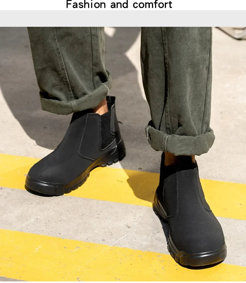 Pair of black slip-on boots worn with rolled olive trousers, standing across yellow road markings 6