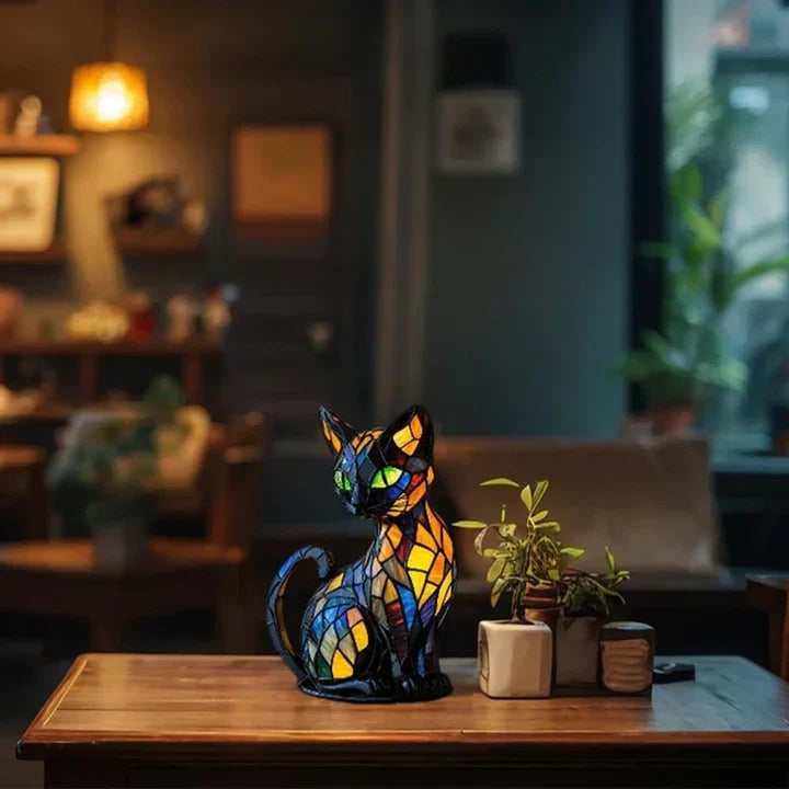 Stained-glass cat lamp on a wooden table next to small potted plants in a cosy, dimly lit room 4
