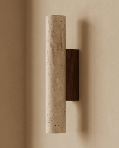 Side profile of the unlit travertine cylinder mounted on its dark wood backplate 6