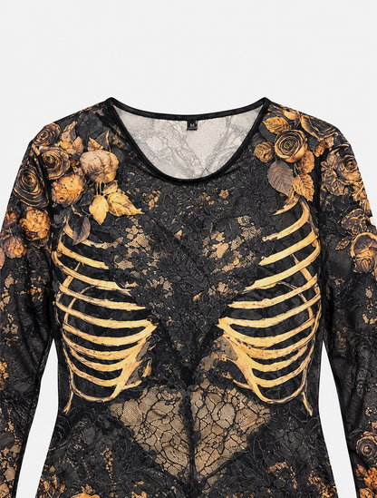 Close-up flat lay of the dress bodice, showing sheer black lace, a gold rib-cage print, rose shoulders and a round neckline. 7