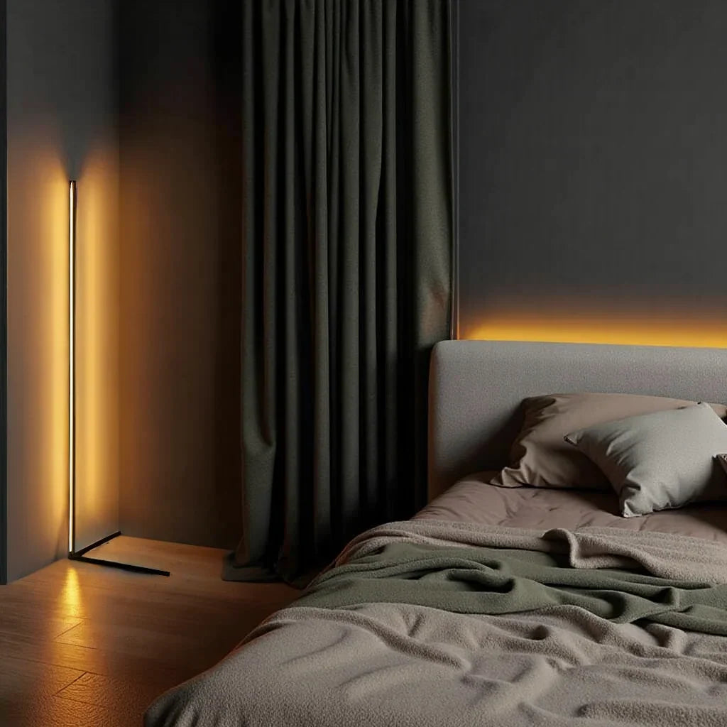Lamp glowing amber beside dark green curtains, with a bed and warm light behind the headboard 9