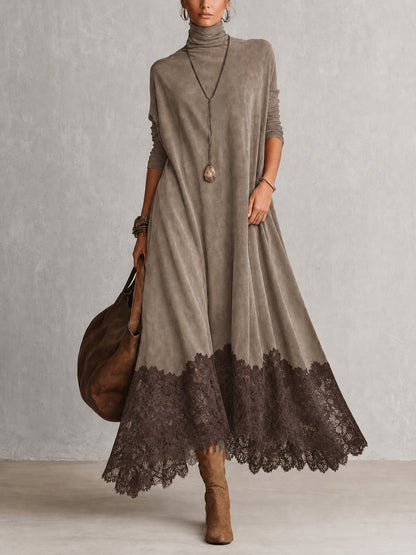 Front view of the dress in taupe with a darker brown lace hem, worn with boots 8
