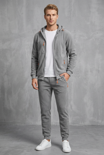 Front view of the light grey set in a soft fleece-like fabric with orange zip pulls 10