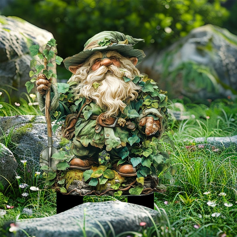 Bearded garden gnome in an ivy-covered green outfit and hat, holding a leafy staff, standing among rocks and grass. 3