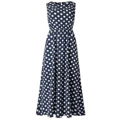 Navy blue sleeveless midi dress with white polka dots, shown flat from the front with an elasticated waist. 6
