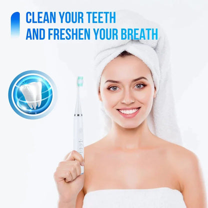 Second view of the woman in a hair towel holding the white electric toothbrush, with a tooth graphic and green-tipped brush head. 8