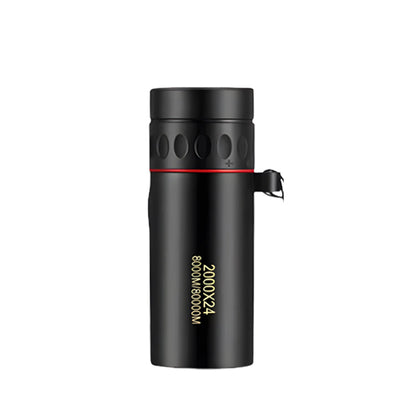 Black cylindrical monocular with a ribbed focus ring, red accent band and wrist strap, on white 1