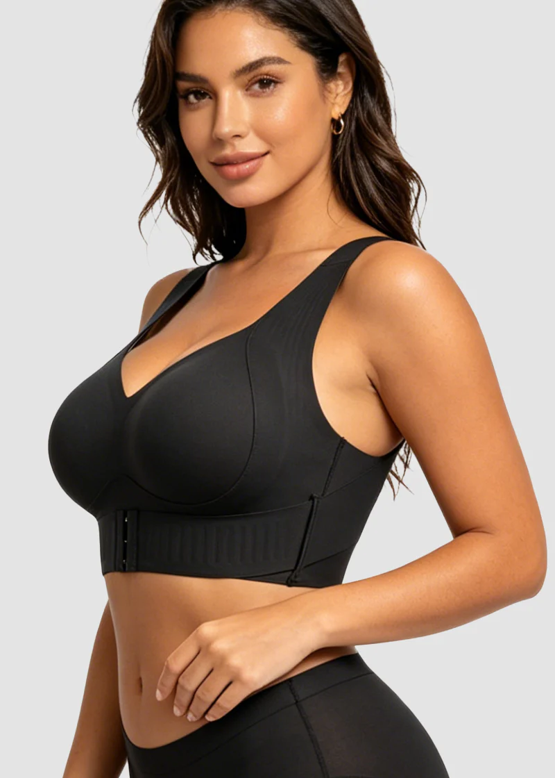 Three-quarter front view of the black bra on a model, showing the V neckline, wide straps and ribbed band. 14