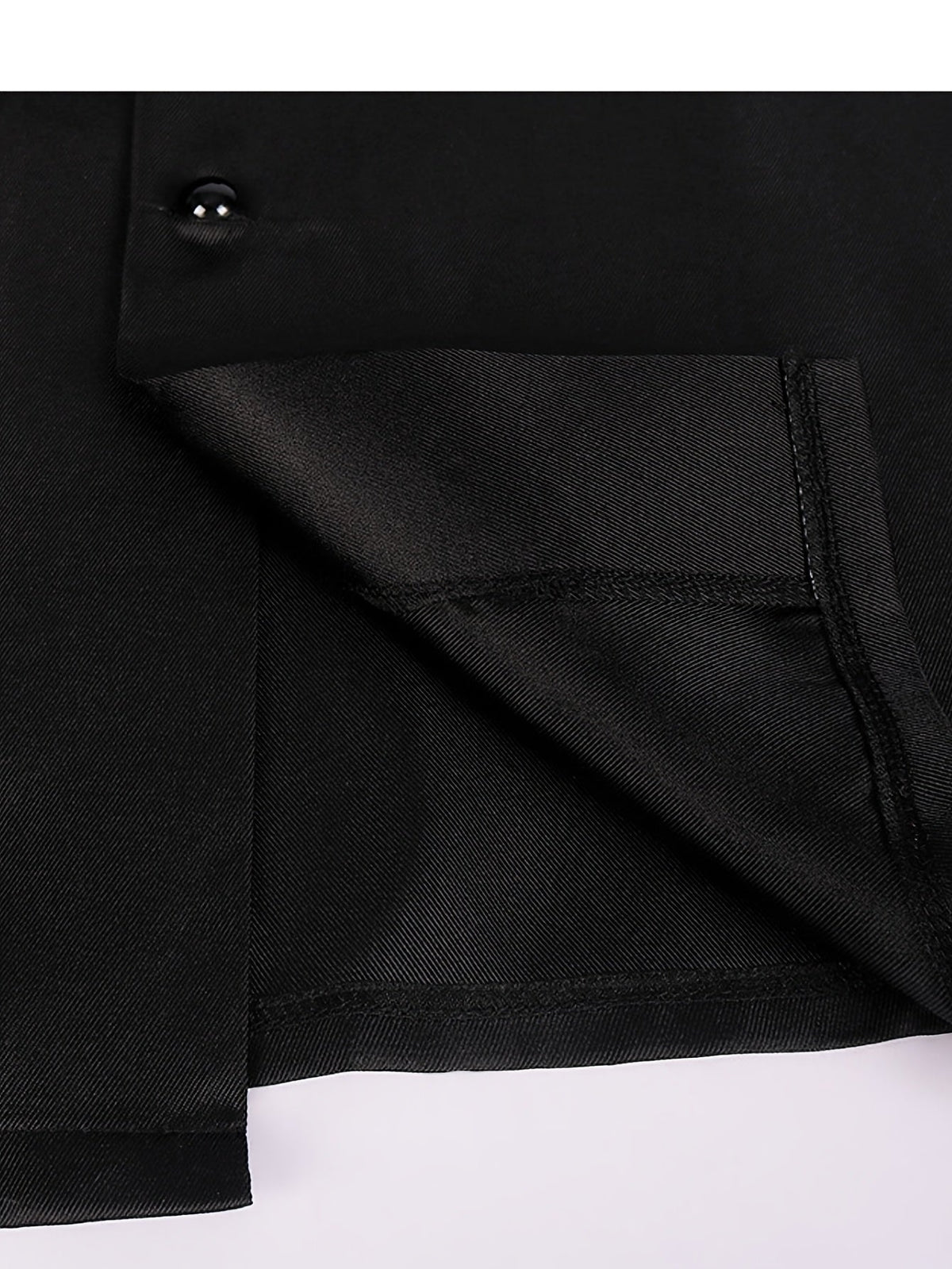 Close-up of the robe's hem and side slit, showing the inner lining, stitching and a black button 9