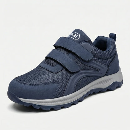Single navy shoe with two hook-and-loop straps and a grey sole, angled front view on white 11