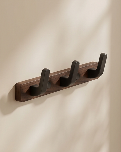Three-hook version mounted on a pale wall, seen at an angle with soft shadows 6