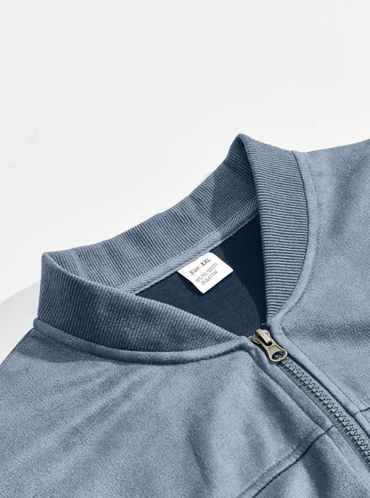 Close-up of the light blue ribbed stand collar, metal zip and inner size label 7