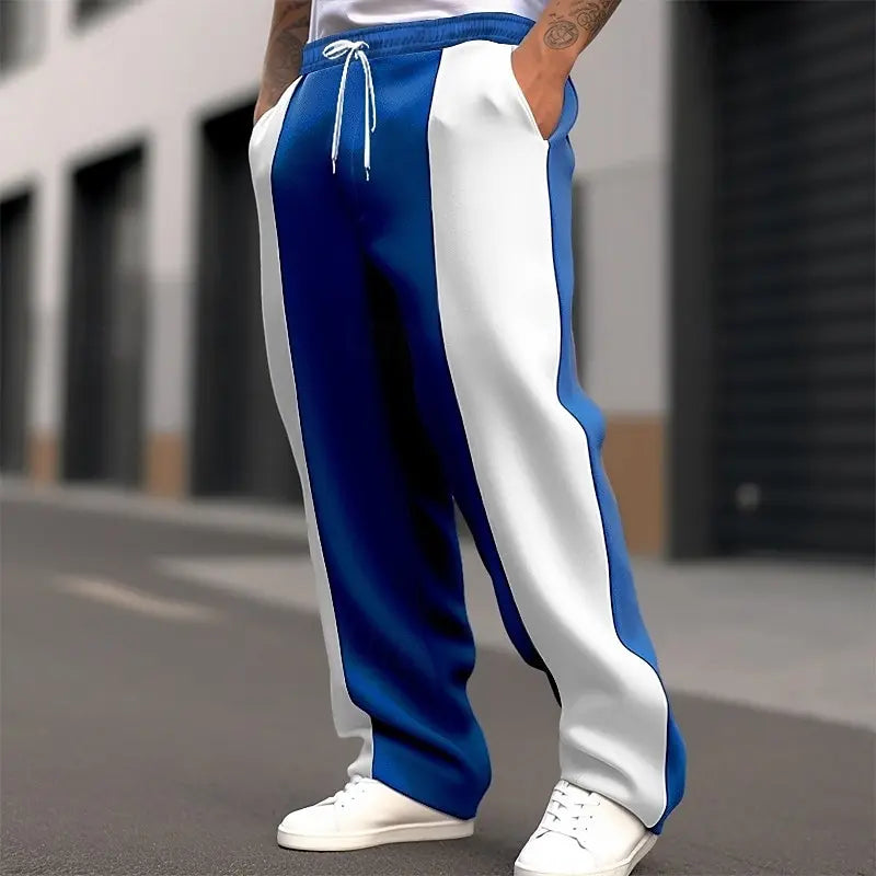 Street shot, lower body, of royal blue and white colour-block sweatpants with white drawstring 7