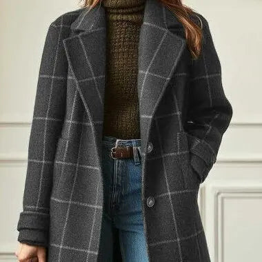 Cropped view of the charcoal coat showing two buttons, a patch pocket and a turned-back cuff 7