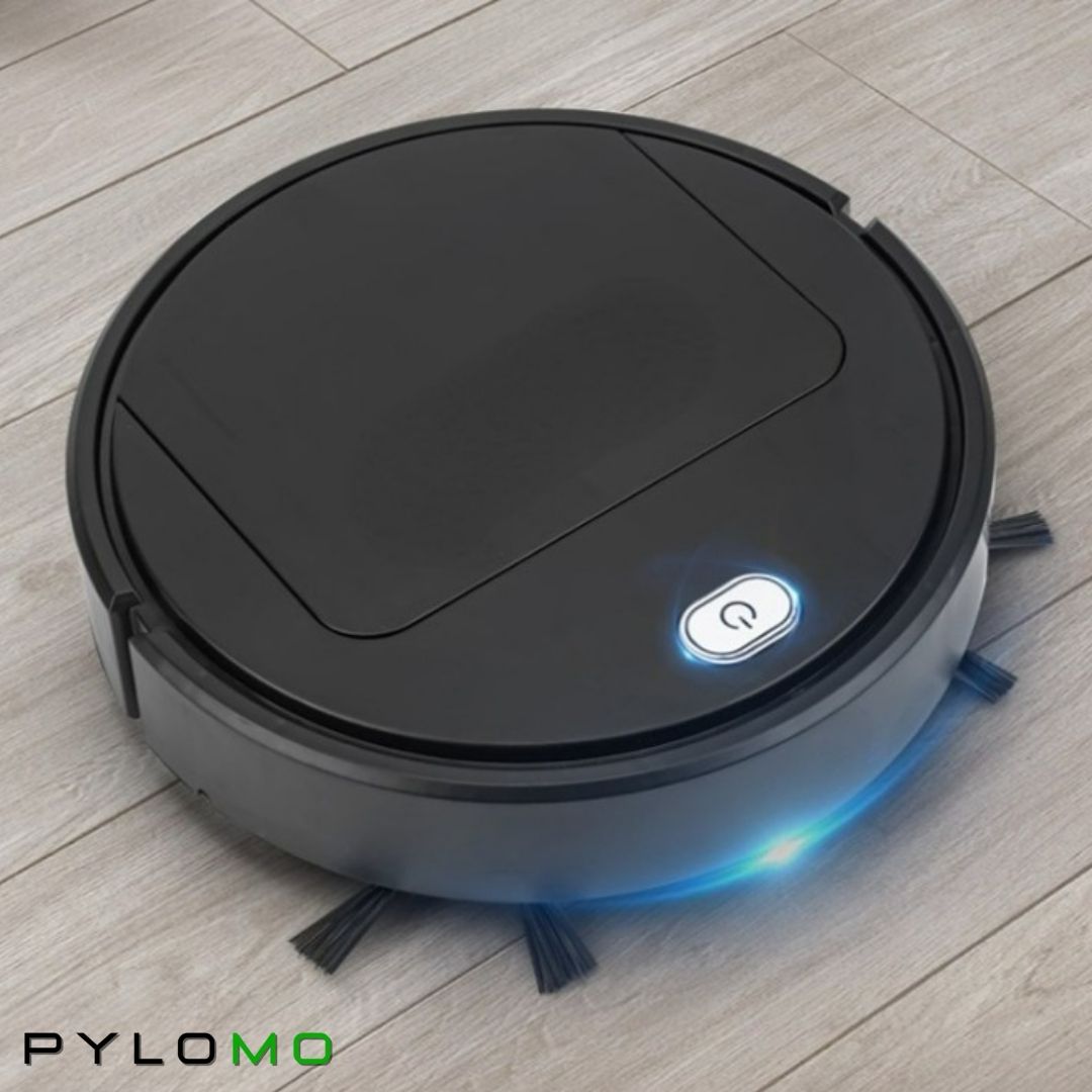 Black robot cleaner on a pale wooden floor, its power button and blue edge light glowing, side brushes visible. 4