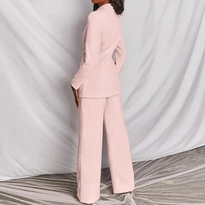 Pale pink suit from behind and slightly to the side, showing the back of the blazer and trousers 7