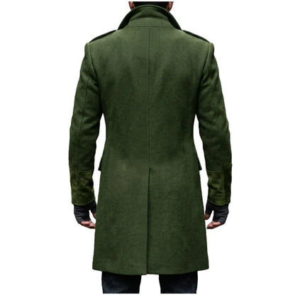 Back view of the green overcoat on a model, showing the centre back seam, epaulettes and suede-look cuffs 7