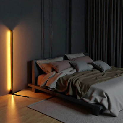 Lamp glowing amber against a dark panelled wall, next to a low platform bed 2