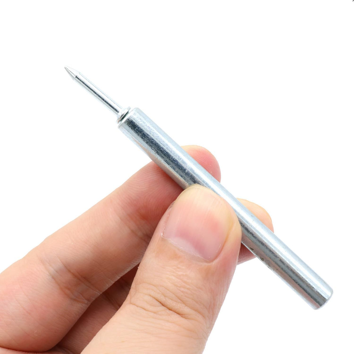 Hand holding the cylindrical sleeve tool with one nail seated in its end, ready for installation. 5