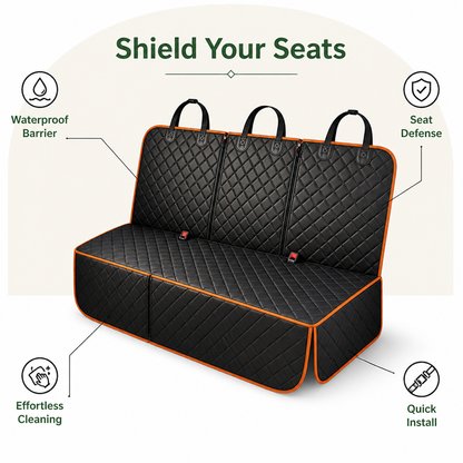 Black quilted rear seat cover with orange piping shown on its own, with three headrest loops, side flaps and seat belt openings. 2