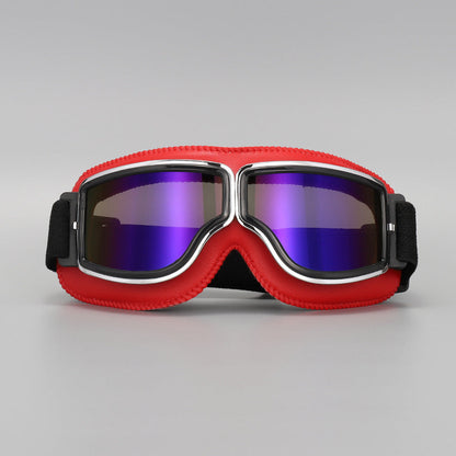 Front view of the red-padded goggles with chrome trim and purple-blue mirrored lenses. 12