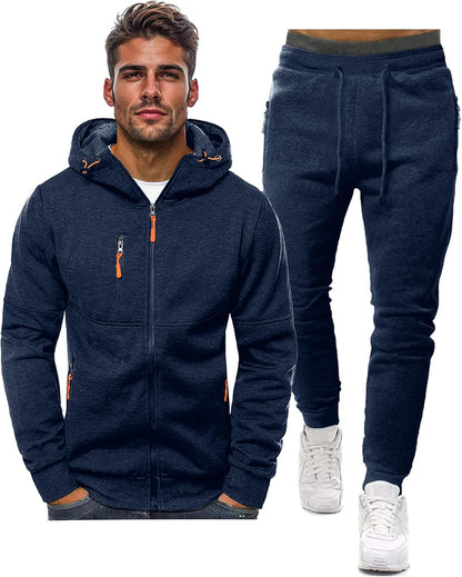 Navy hooded zip jacket beside matching drawstring joggers, on a white background, with orange zip pulls 2
