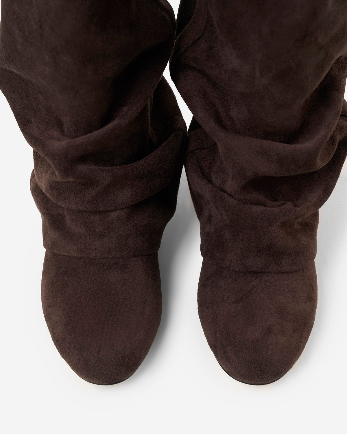 Top-down view of the pair showing the rounded toes and the soft, creased folds of the suede-effect shafts. 5