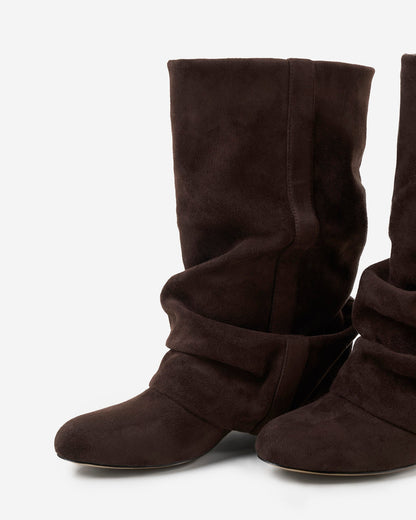 Angled close-up of the pair showing the rounded toe, the stitched strap across the ankle and the soft gathered shaft. 6